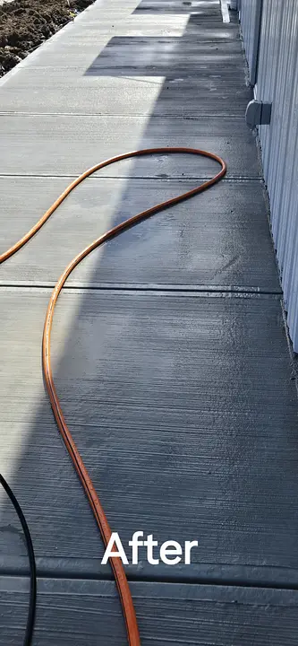 After: the same concrete walkway cleaned by AB Pressure Solutions
