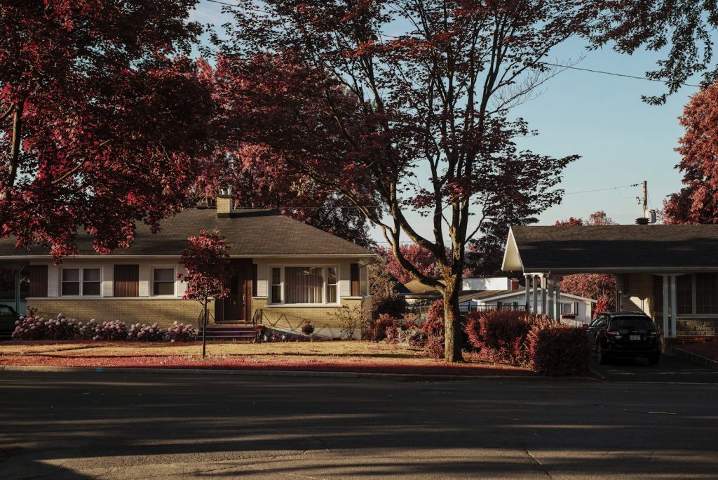 A suburban home with a car parked in the driveway in Greenwood, Indiana